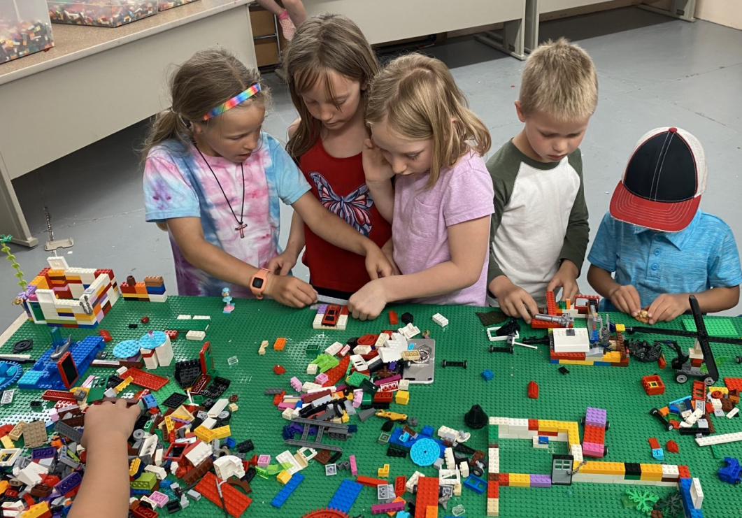 Kids playing with LEGO bricks together at a Baseplate Labs event